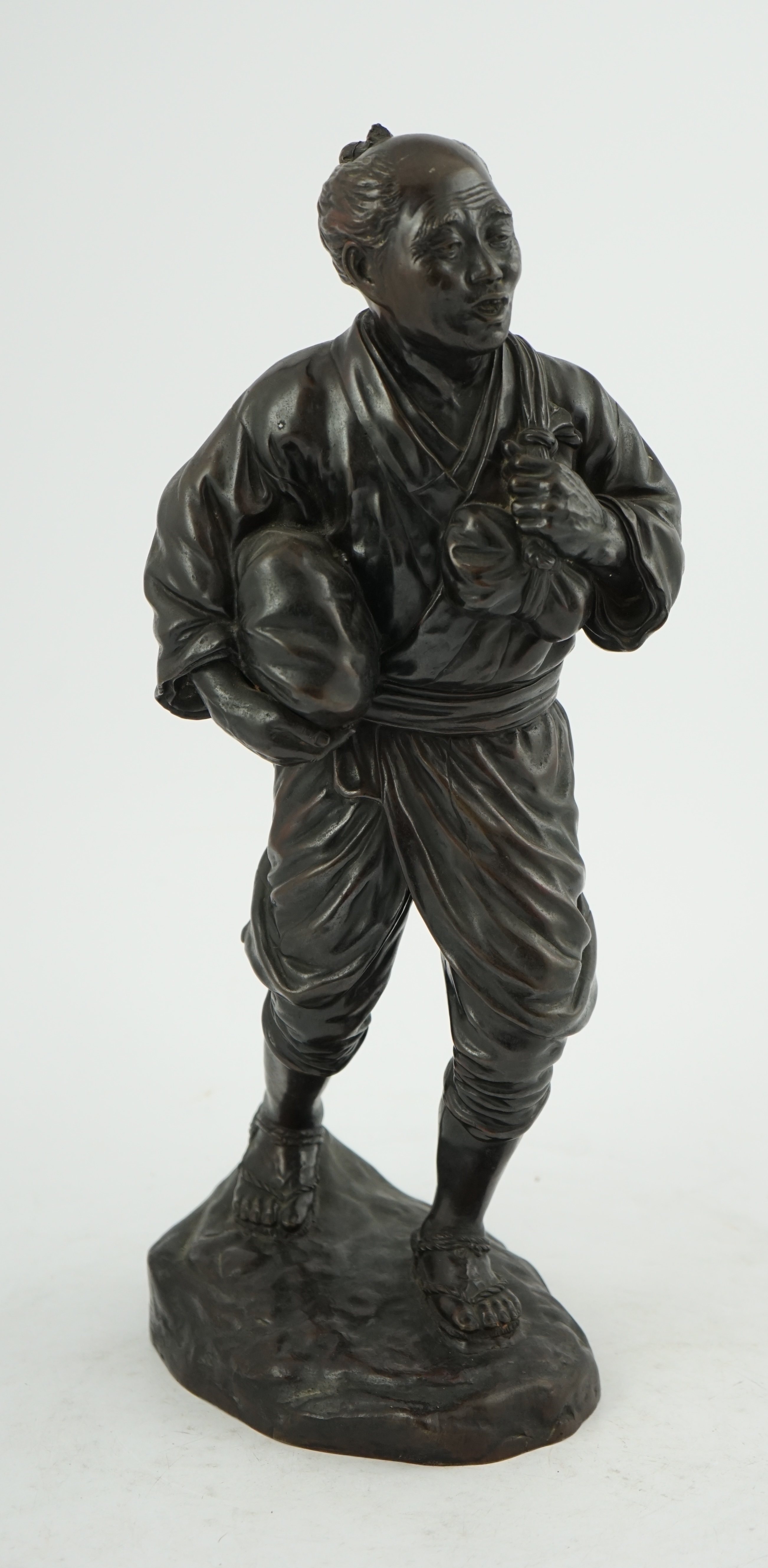 A Japanese bronze figure of a man, 19th century